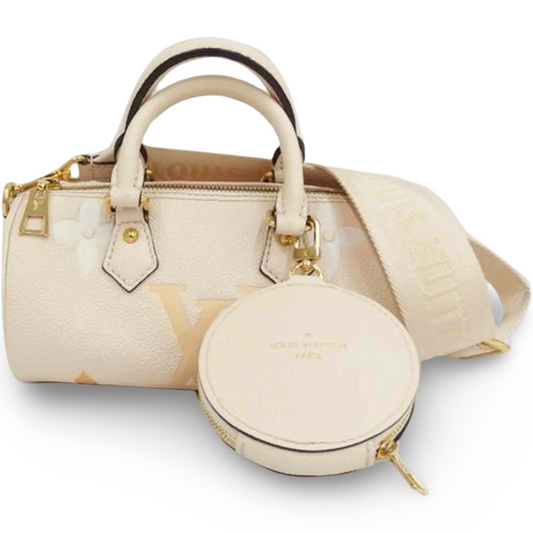 Louis Vuitton Papillon BB ivory beige grained leather with oversized Monogram print, rolled top handles, and a structured barrel silhouette. Previously Owned | Good Condition | L’LUXE Authentics