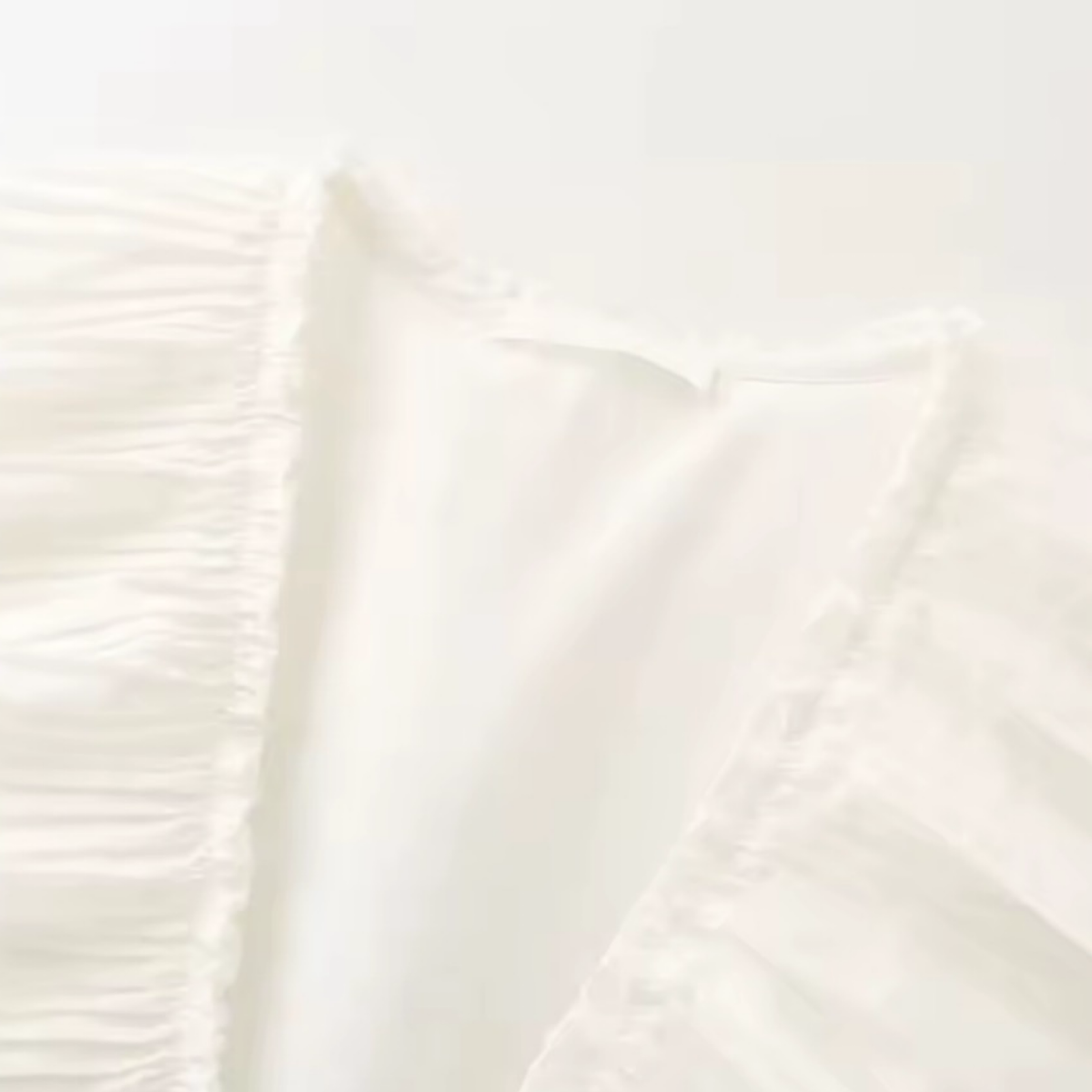 Sleeveless Pleated Peplum Top Bow Detail